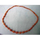 A graduated butterscotch amber bead Necklace, single row, the polished beads of varying shape,