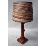 Robert 'Mouseman' Thompson of Kilburn, an oak Table Lamp, octagonal tapering column with carved leaf