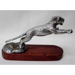 A Jaguar Car Mascot by Desmo, chromed and textured in leaping pose on integral naturalistic support,