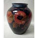 A large Moorcroft pottery vase, ovoid form with everted rim, tubeline decorated in Pomegranate