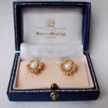 A good quality pair of 20th century 18ct gold and pearl set Ear clips by Mappin and Webb, each as