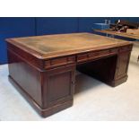 A Victorian mahogany Partners Desk, the moulded edge rectangular top with faded green tooled leather