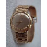 A Delano ladies 18K Wrist Watch, gilt dial 19.4mm with baton markers signed Delano, integral 18K