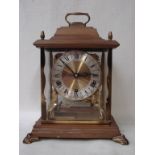 A mid century German Schatz brass framed and wooden cased eight day Mantel Clock