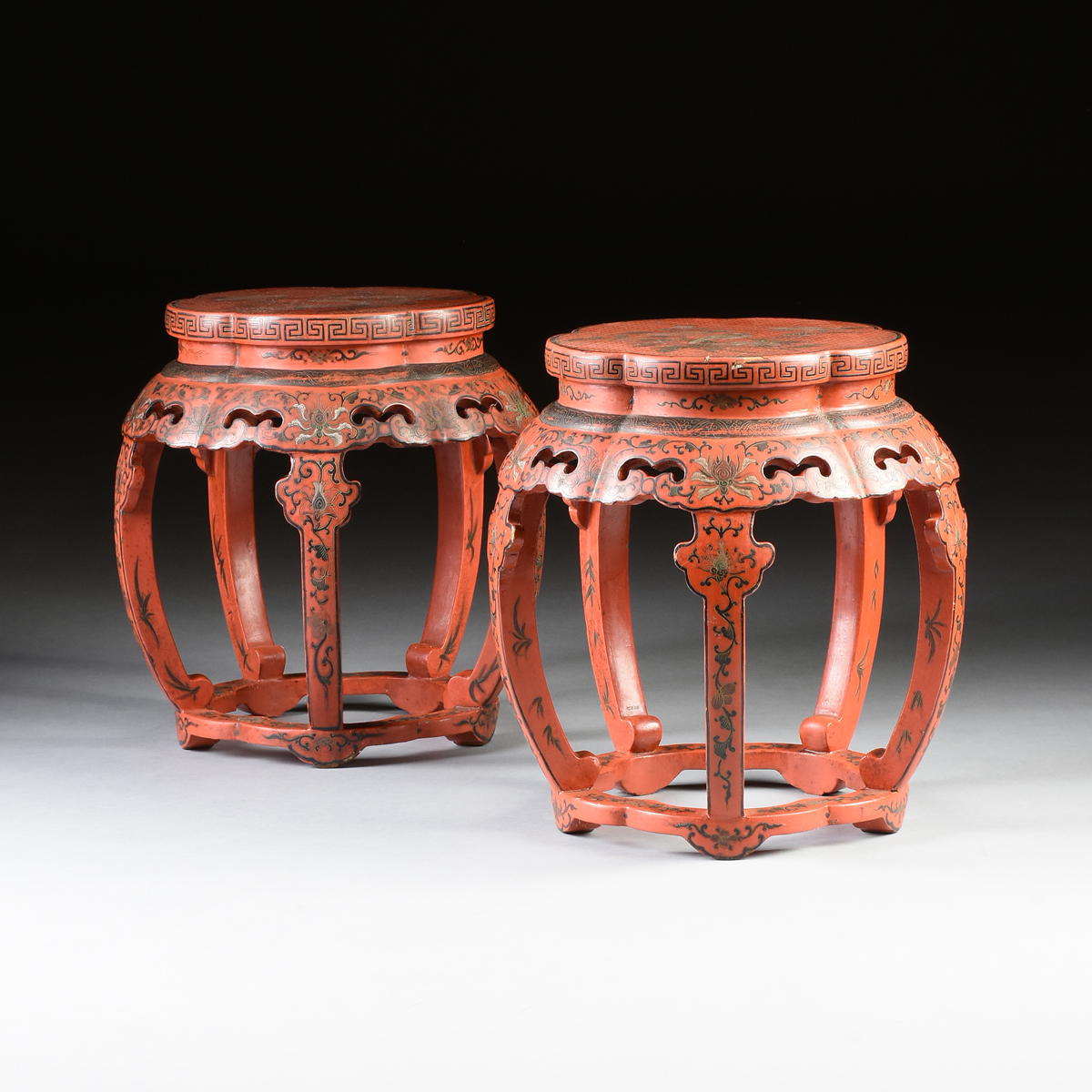 A PAIR OF CHINESE RED LACQUERED WOOD GARDEN SEATS, MID TO LATE 20TH CENTURY, of lobed pentagonal