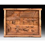 A FRENCH PRIMITIVE FOLK ART CARVED WOOD PANEL, 21ST CENTURY, carved with a village scene of thatched