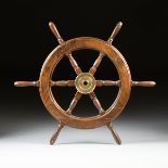 A CARVED PINE WOODEN SHIP'S WHEEL, 20TH CENTURY, carved with turned and tapered spokes and