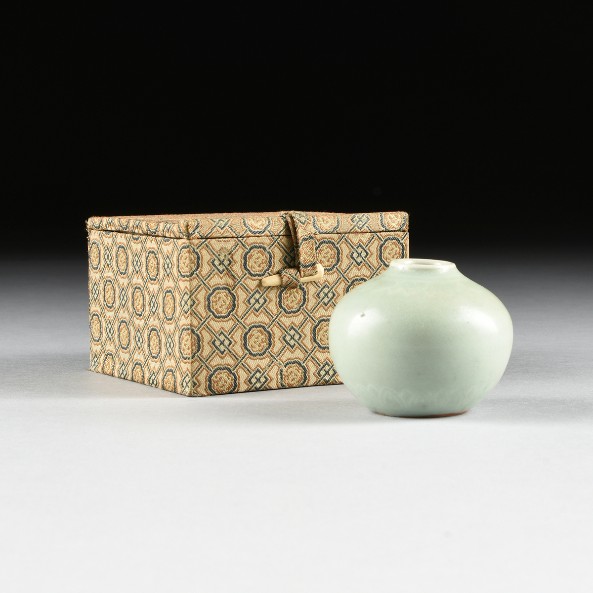 A KOREAN SLIP INLAID CELADON VASE, CHOSON DYNASTY (1392-1910), of squat globular form with incised