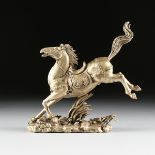 A CHINESE LATE MING STYLE SILVERED METAL HORSE, EARLY-MID 20TH CENTURY, in galloping pose wearing