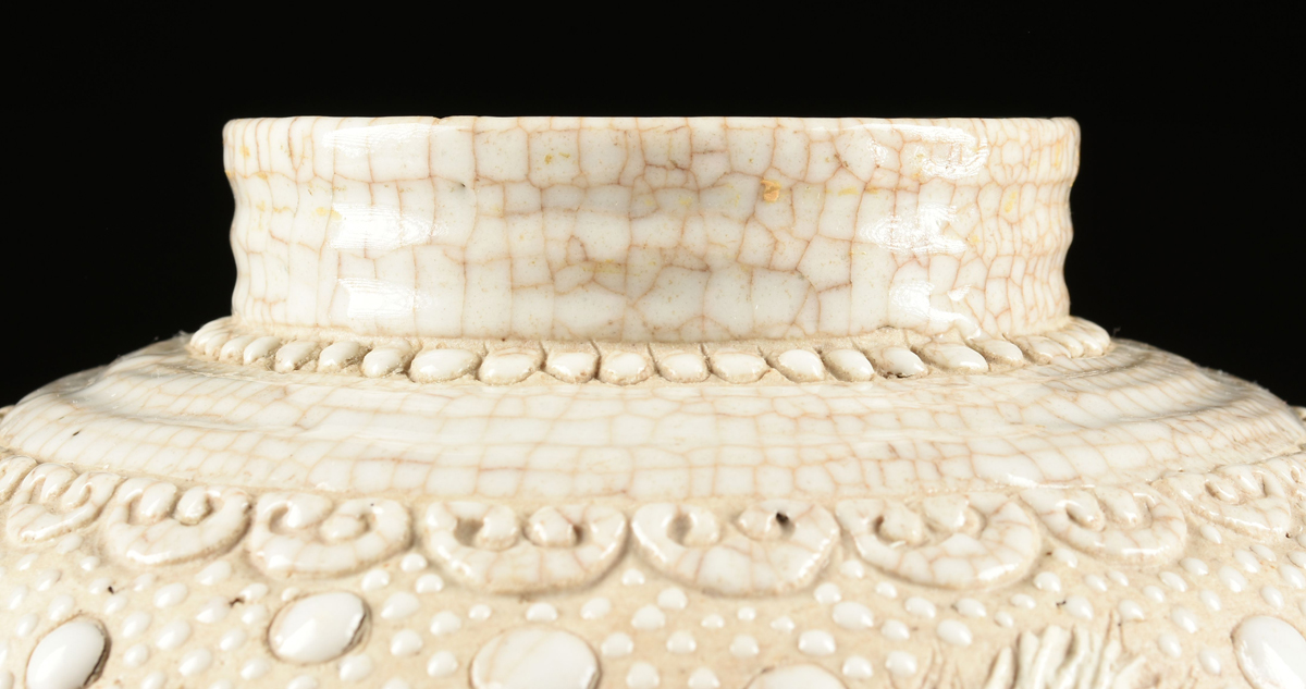 A CHINESE PORCELAIN URN WITH MOLDED DECORATION, 20TH CENTURY, with cream crackle glaze and molded - Image 3 of 14