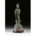 A LARGE CHINESE CARVED SERPENTINE MARBLE STANDING FIGURE OF QUANYIN, 20TH CENTURY, the robed