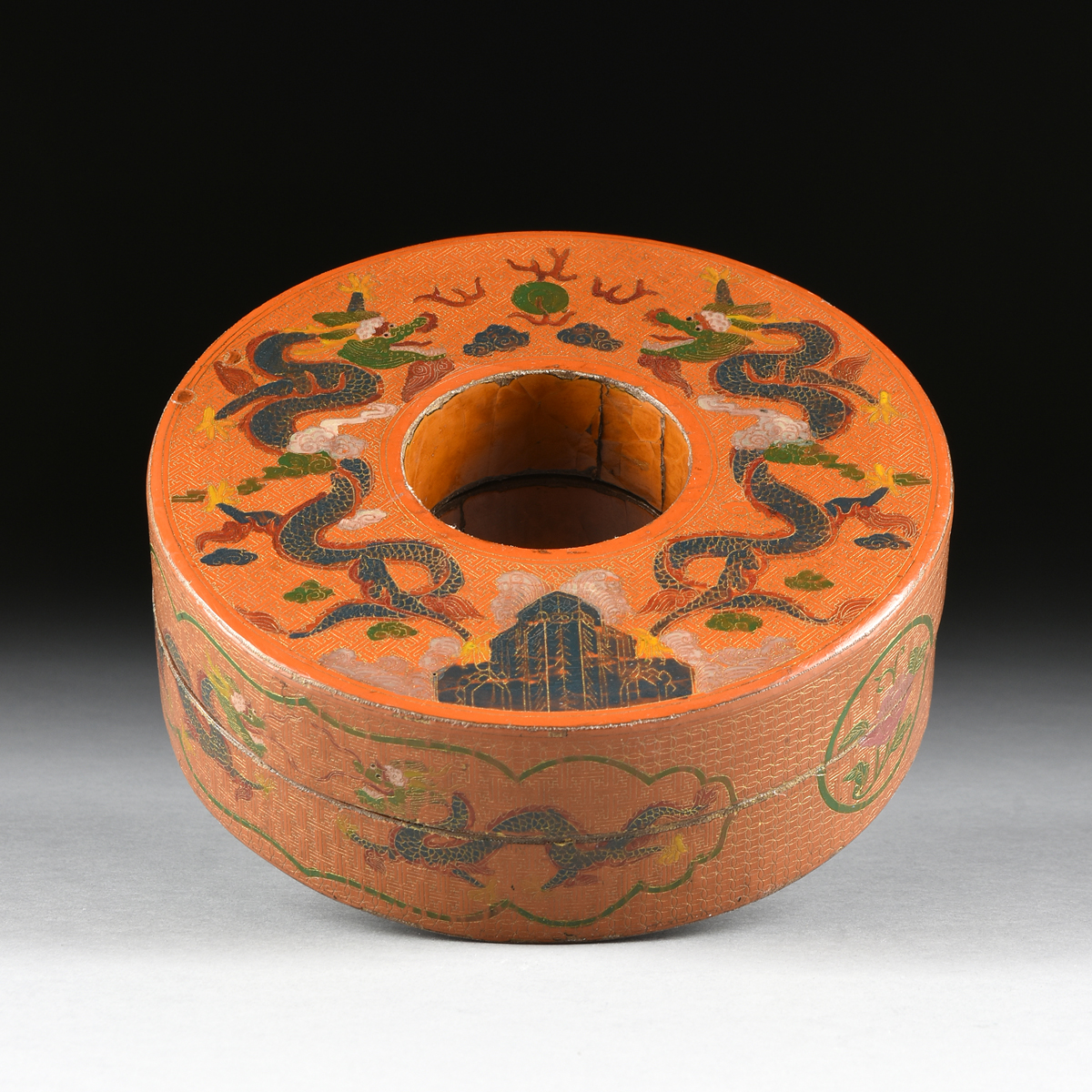 A CHINESE COIN FORM COVERED LACQUERED WOOD BOX, EARLY 20TH CENTURY, the orange lacquered wood box of