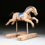 A LATE VICTORIAN POLYCHROME CAST IRON CHILD'S CAROUSEL HORSE, CIRCA 1905, in full stride gallop with