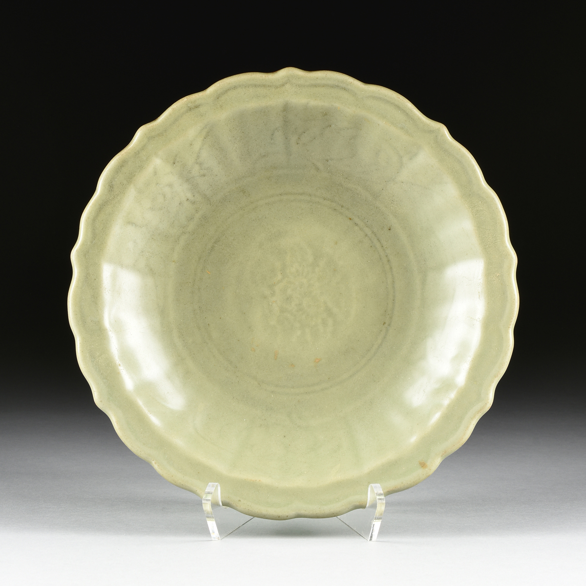 A CHINESE LONGQUAN CELADON CHARGER, MING DYNASTY (1368-1644), of lobed form with fluted sides and