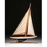 A CARVED WOODEN SAILBOAT MODEL, CIRCA 1920, carved mahogany and polychrome decoration with