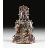 A CHINESE PARCEL GILT AND POLYCHROME BRONZE STATUE OF VAIROCANA (CELESTIAL) BUDDHA, MING DYNASTY