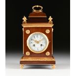 A GILT BRONZE MOUNTED MAHOGANY AND ENAMEL MANTLE CLOCK, POSSIBLY ENGLAND, CIRCA 1930, the temple