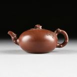 A CHINESE RED STONEWARE TEAPOT, YIXING PROVENCE, REPUBLIC PERIOD, CIRCA 1917-1949, a blossoming