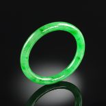 A JADEITE JADE LADY'S BANGLE, the semitranslucent tested jadeite jade measuring 12.7 millimeter