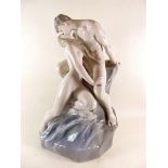 A large Royal Copenhagen porcelain group "Wave and Rock" depicting Prometheus bound by his wrists