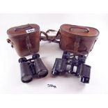 A pair of Grossfeld military (TIMBERS 1928) binoculars and another pair by Ross, both leather cased