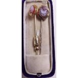 A gold cameo stick pin boxed and one other