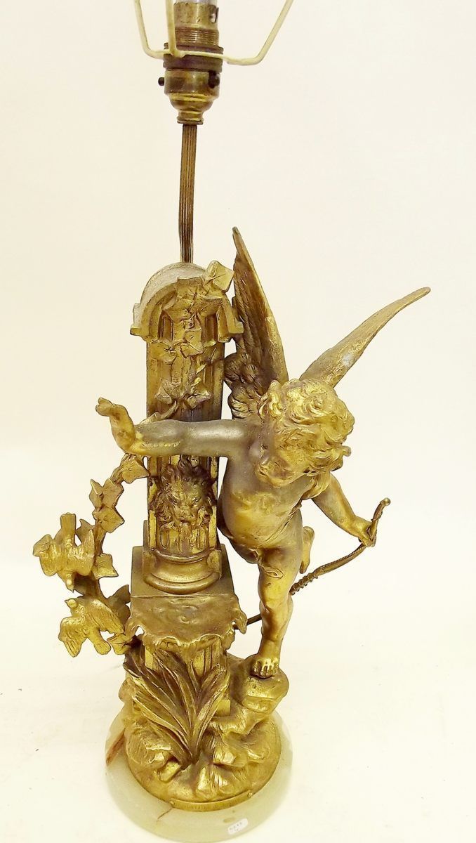 A gilt metal table lamp in the form of a cherub and two doves 'La Fountaine du Jouvence' - 41cm