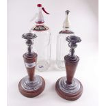Two glass soda siphons and a pair of candlesticks