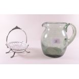 A vintage hand blown glass jug and a glass bon bon dish in silver plated stand