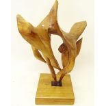A large carved wooden sculpture of swans , 65cm high incl stand