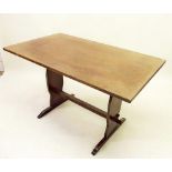 A 20th century oak refectory style small dining table