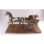 A brass horse and carriage