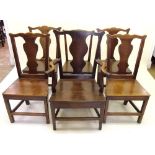 A George III matched set of six oak dining chairs (one carver and five diners) three with replaced