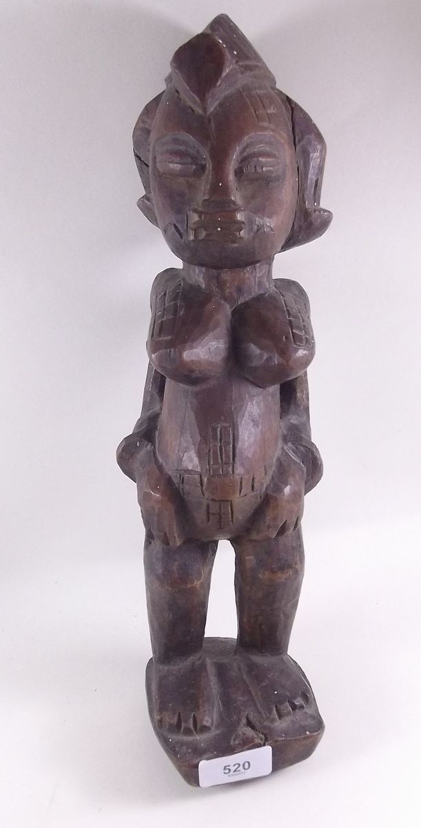 An antique African carved fertility figure