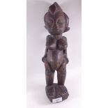 An antique African carved fertility figure