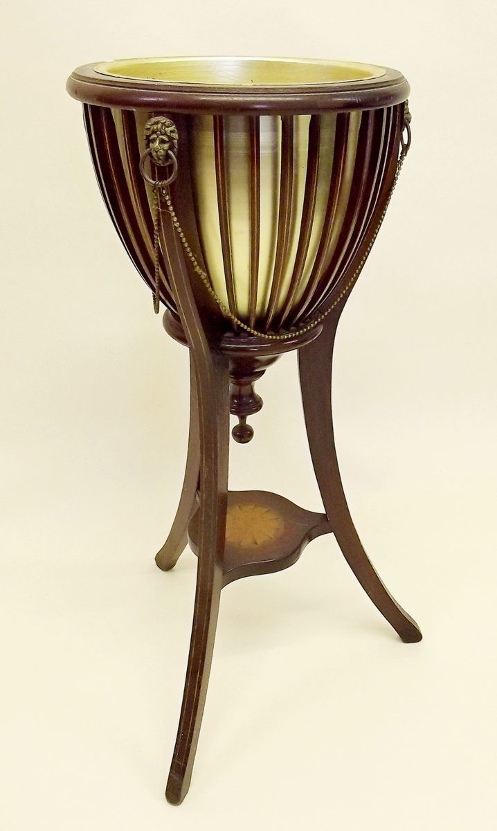 A reproduction Edwardian style mahogany jardiniere stand with inlaid decoration, 33.5" high