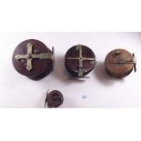 Four antique brass and wooden fishing reels