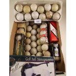 A box of old golf balls