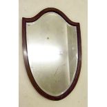 An Edwardian shield form mirror