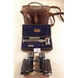 An 'Ultra lens' magnifying glass and a pair of Carl Zeiss 8 x 30 binoculars and case