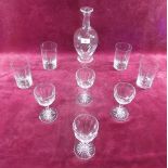 Four water glasses, four sherry glasses and a hand blown spiral carafe
