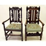 Two Victorian side chairs in the Jacobean manner with ornately carved backs and tapestry seats