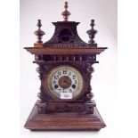 A German carved wood architectural style mantel clock