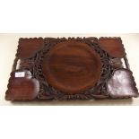 An Indian carved wooden tray