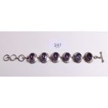 A 9ct gold and mystic topaz bracelet