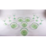 A set of six uranium glass small wine glasses and six dessert dishes