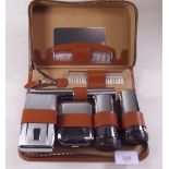 A leather cased gents toiletry set