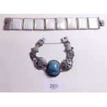 An Eastern white metal and mother of pearl bracelet and a scarab beetle bracelet