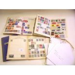 A quantity of world stamps loose and in four juvenile albums
