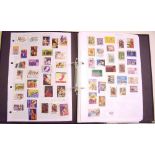 Black loose-leaf album with collection of Australia, Canada and GB regional stamps